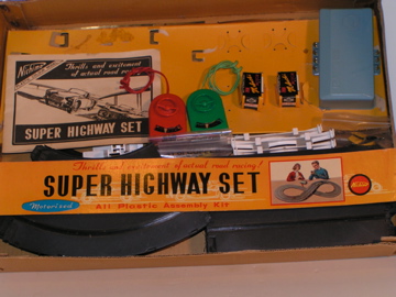 INSIDE THE 1/40TH SCALE MGA SET, THE TRACK,CONTROLLERS, & CARS HAD TO BE ASSEMBLED. RARE