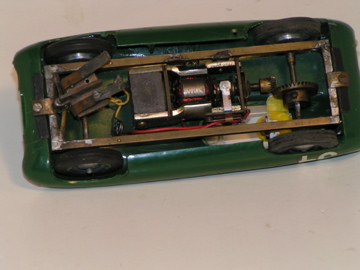 UNDERSIDE OF THE MERIT LOTUS 11 SHOWING THE BRASS CHASSIS & HOMEMADE GUIDE.