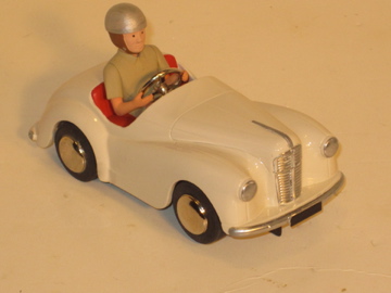 LARGE DRIVER IN SLOT CAR VERSION OF A AUSTIN J40 PEDAL CAR.VERY RARE