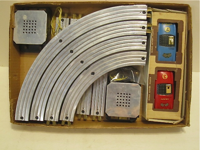 CONTENTS OF THE 1/32ND SCALE 1961 SET. BATTERY OPERATED WITH METAL TRACK. MIB RARE