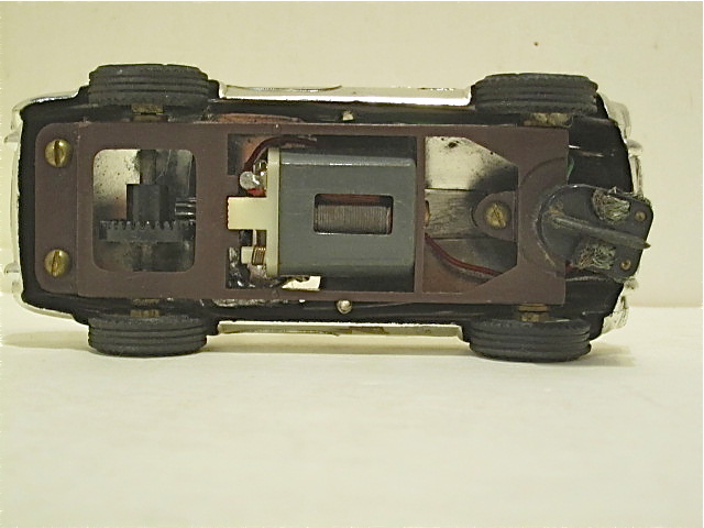 UNDERSIDE OF THE 1/32ND SCALE CHROME PLATED COBRA. PLASTIC FRAME 