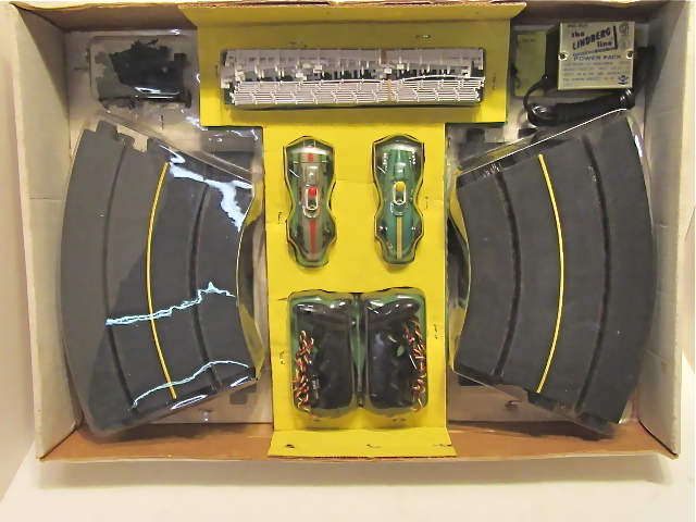 CONTENTS OF THE 1/32ND SCALE SET WITH A PORSCHE 804 & A BRM P57. MIB