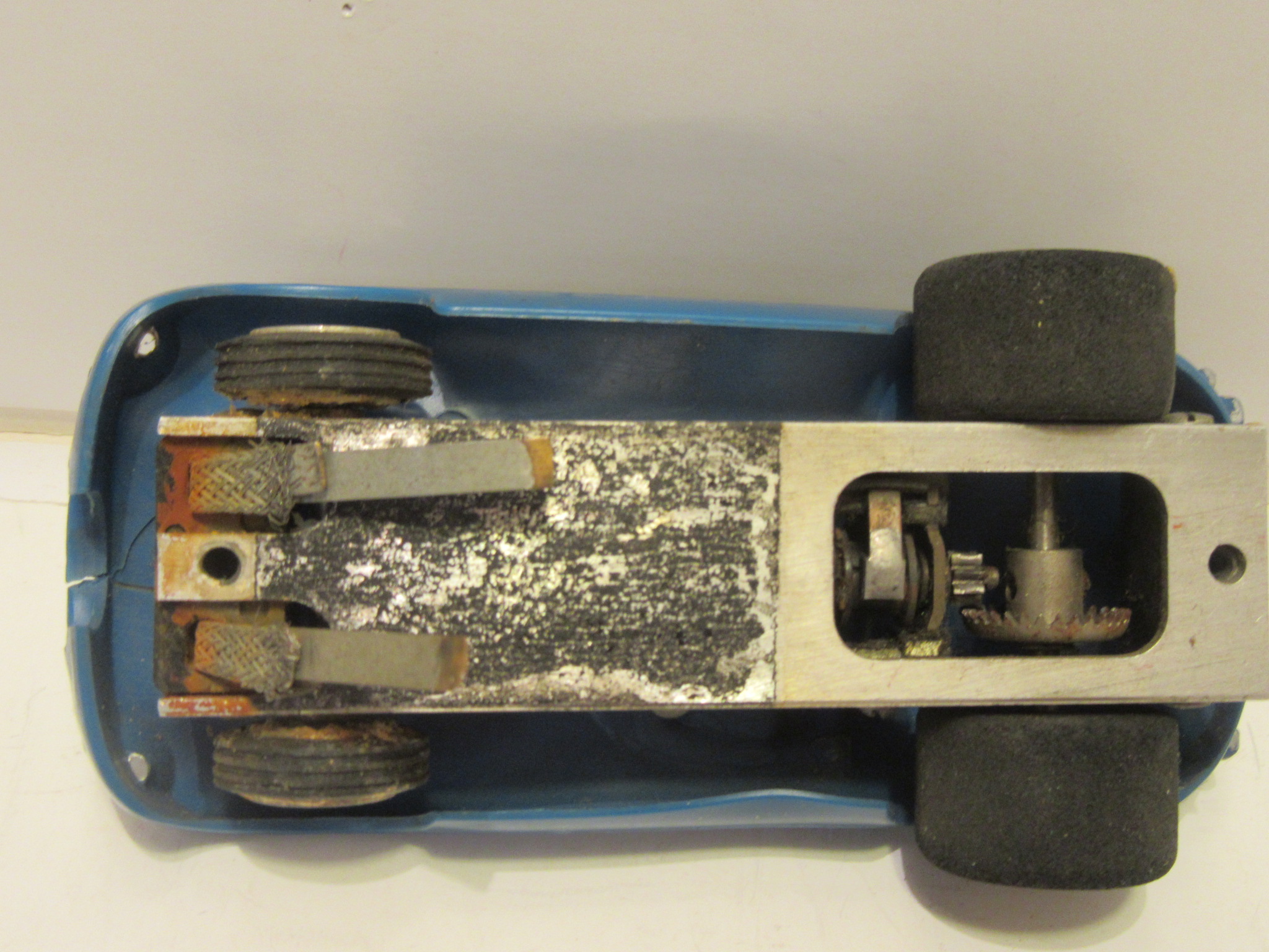 BOTTOM OF THE 1/32ND SCALE JAGUAR D FROM THE SOUTHLAND ENGINEERING SPEEDWAY, A COIN OPERATED PINBALL TYPE COMMERCIAL SET. MADE IN 1963, RARE