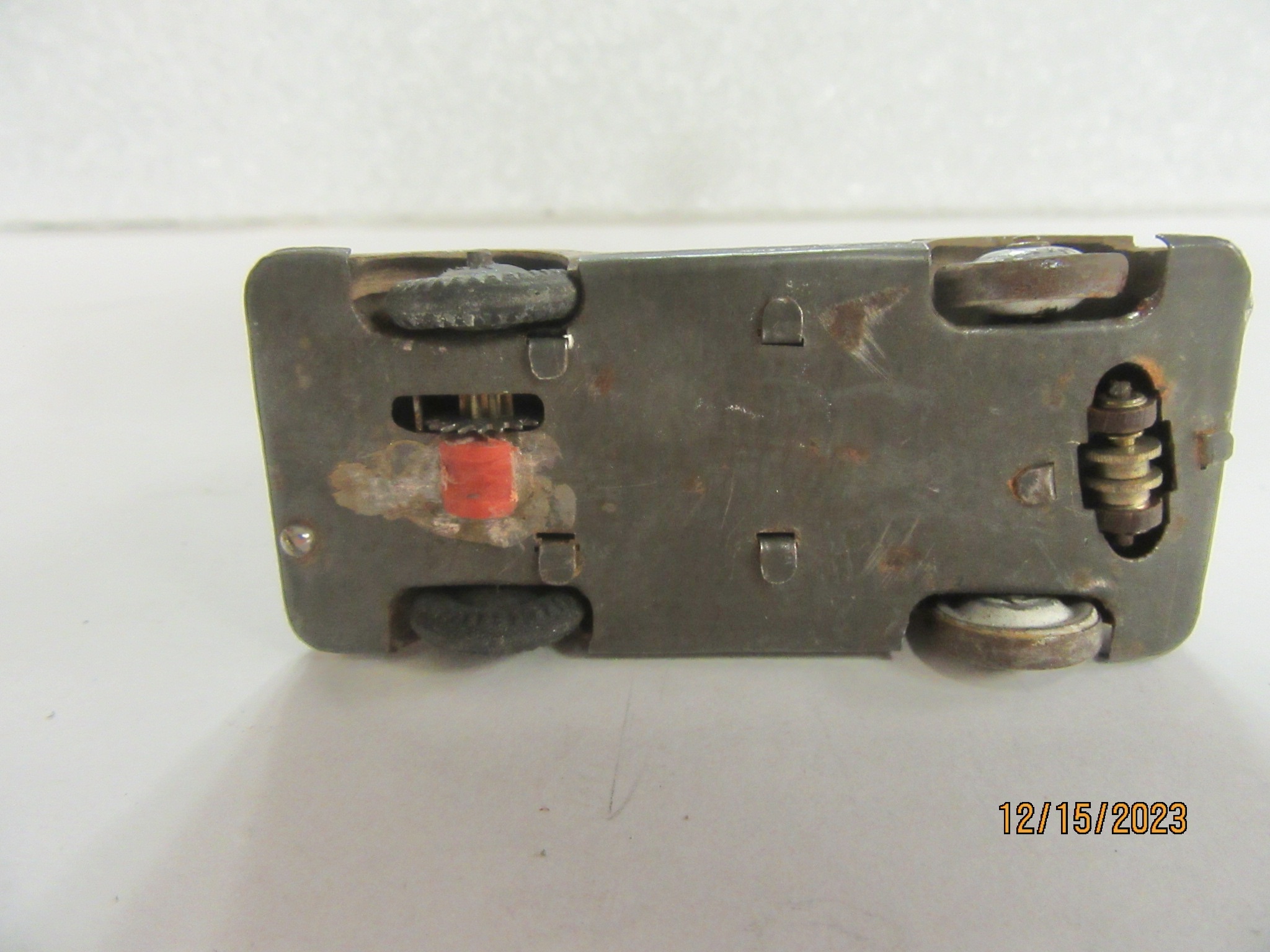 the brass guide is set in a curve. the electricity came from the front left wheel & the guide.