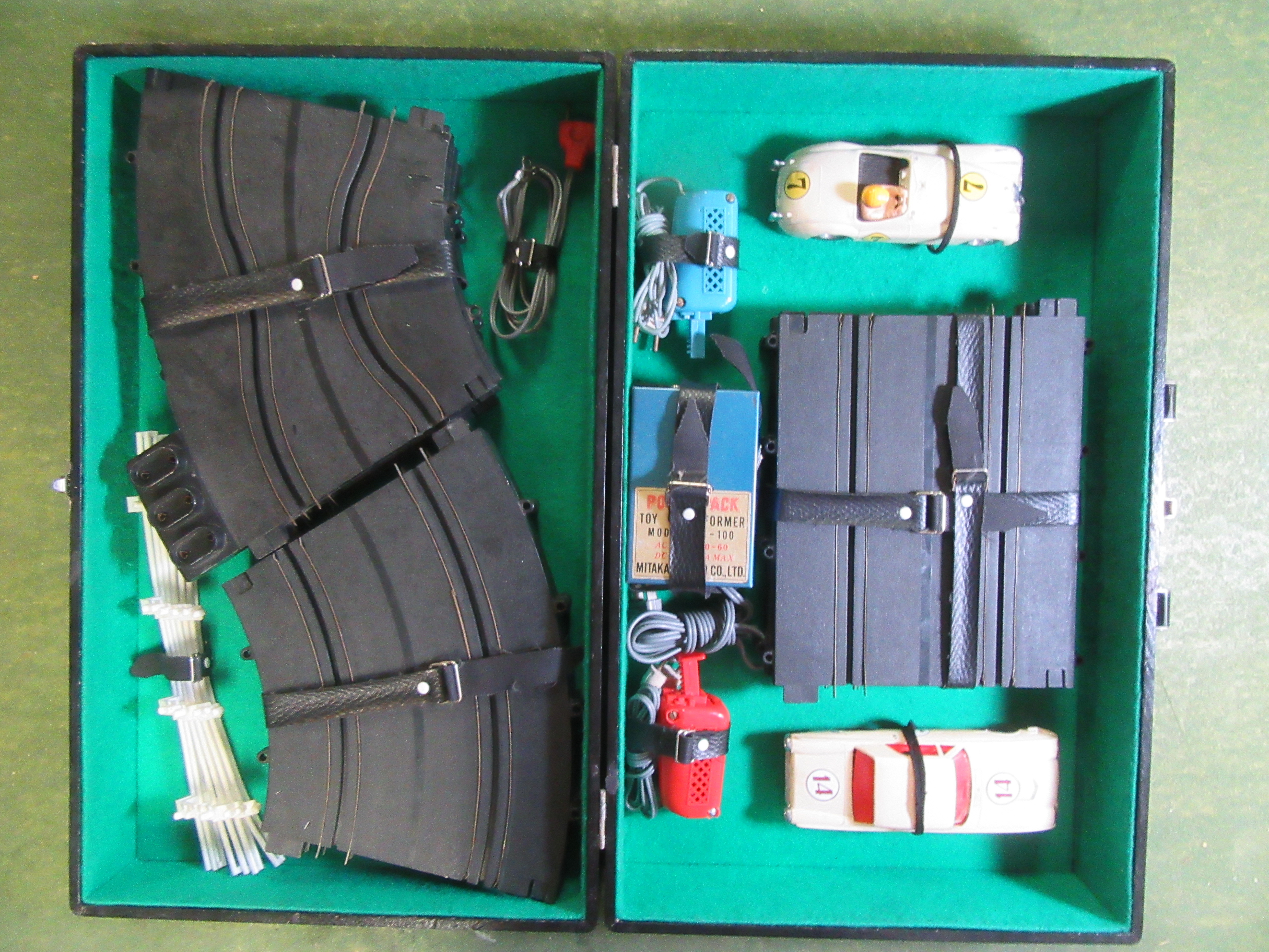 INSIDE THE BRIEFCASE ON THE CAR SIDE SHOWING THE FORD THUNDERBIRD  & THE JAGUAR XK120