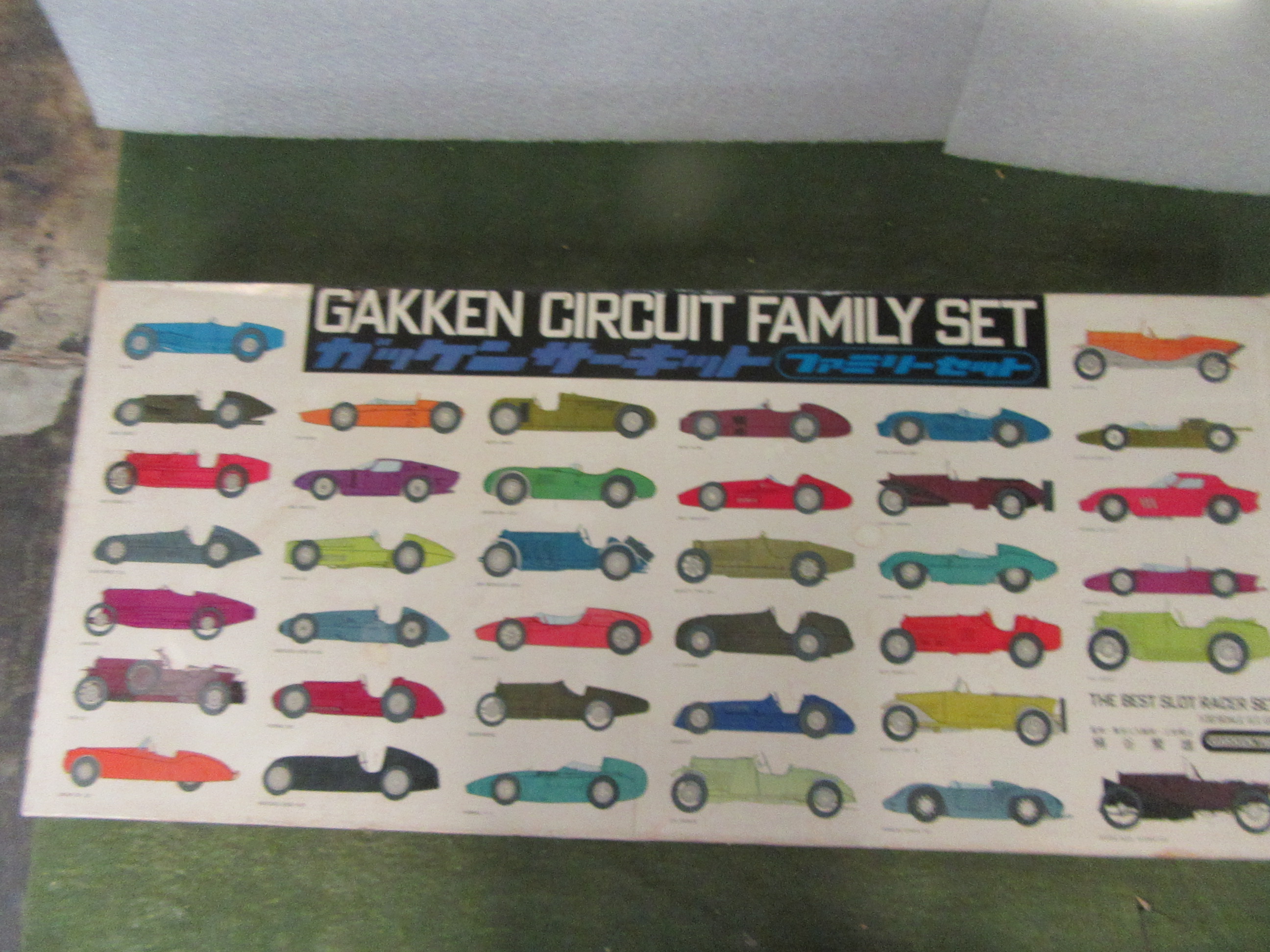 GAKKEN CIRCUIT FAMILY SET WITH 2 CHROME LOTUS 30S. SET IS 19 BY 43 1/2 INCHES !