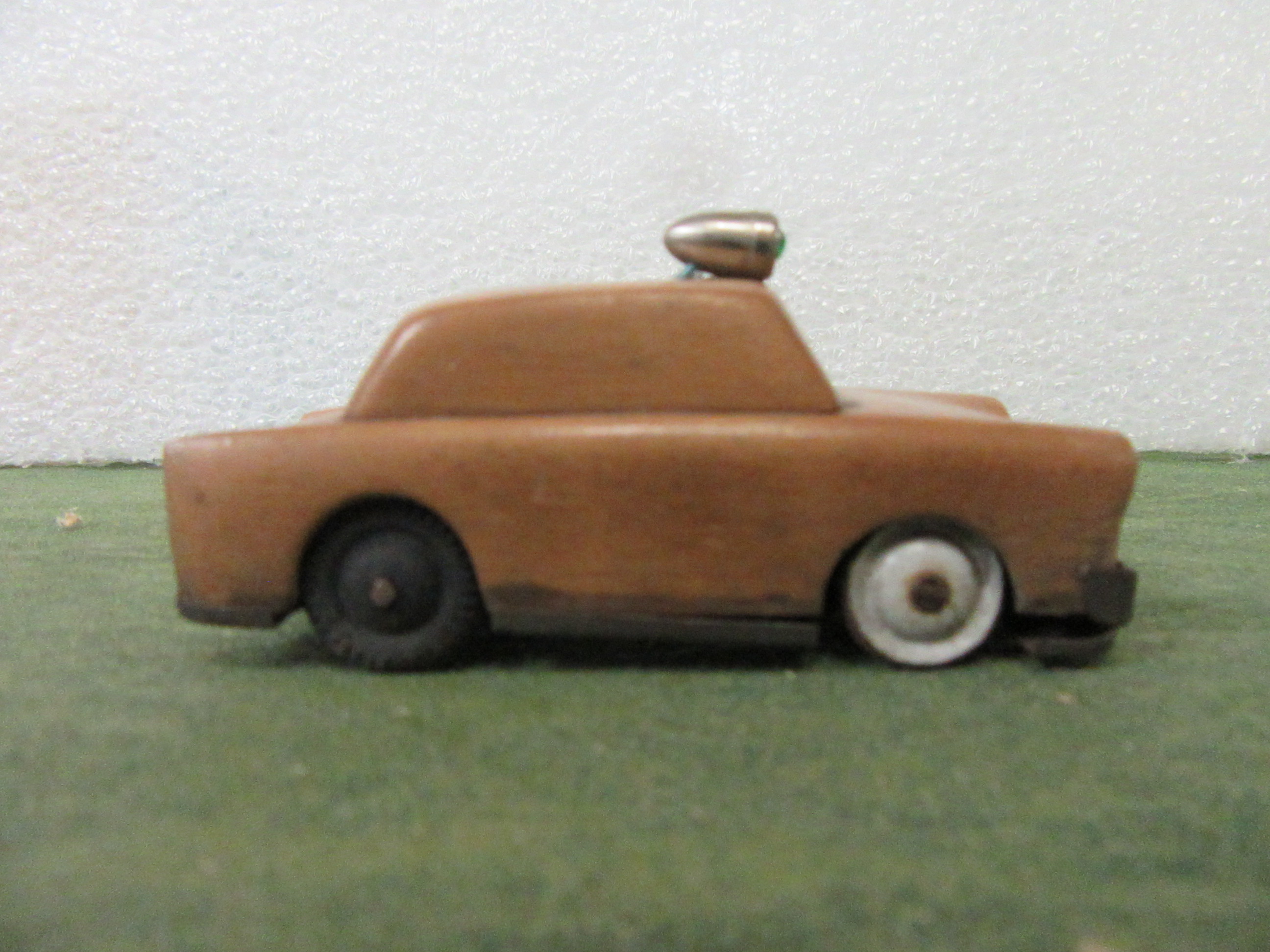 SIDE VIEW OF THE WOOD BODIED 1/43RD SCALE POLICE CAR