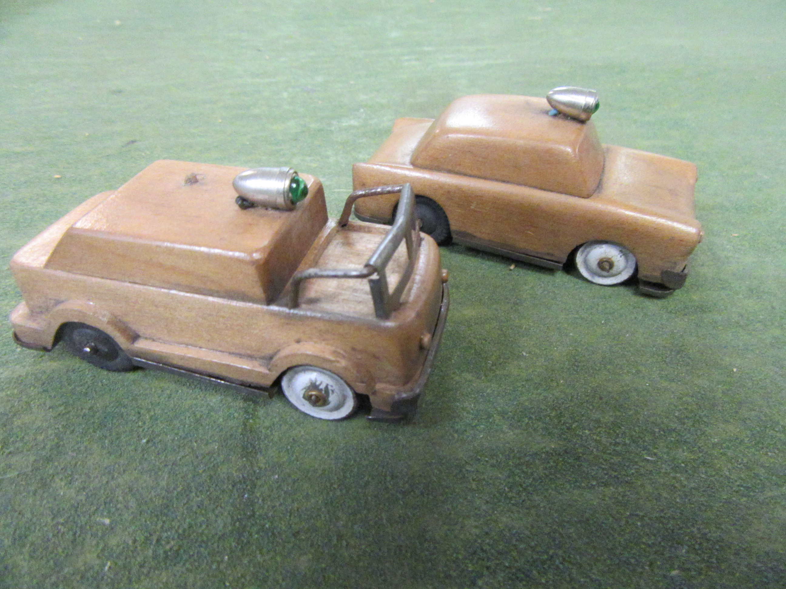 A VIEW OF THE 1/43RD SCALE WOOD BODIED FIRETRUCK & POLICE CAR PROTOTYPES