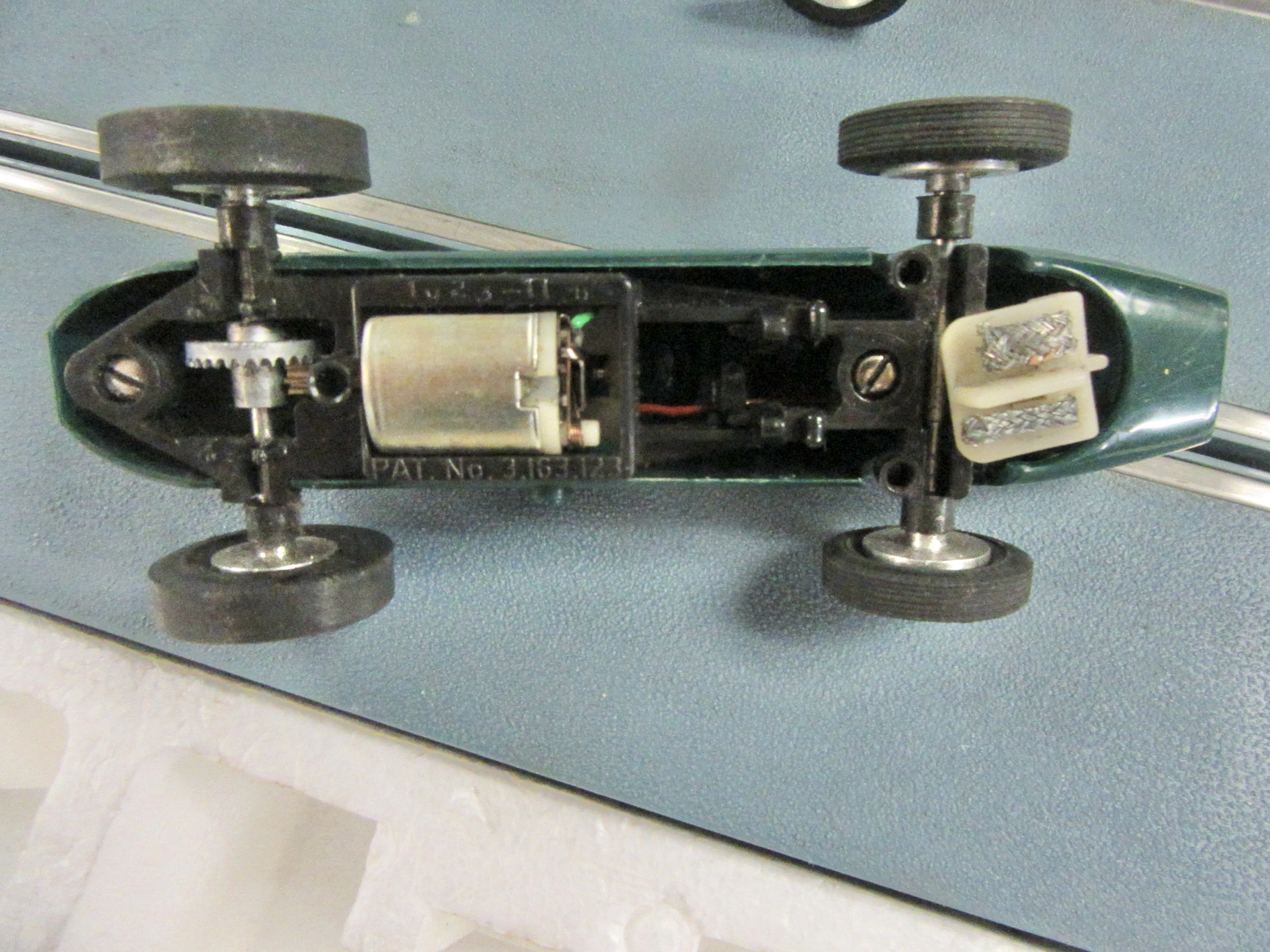CHASSIS OF THE ELDON 1964 LOTUS 34 WITH ITS 12 VOLT MOTOR.