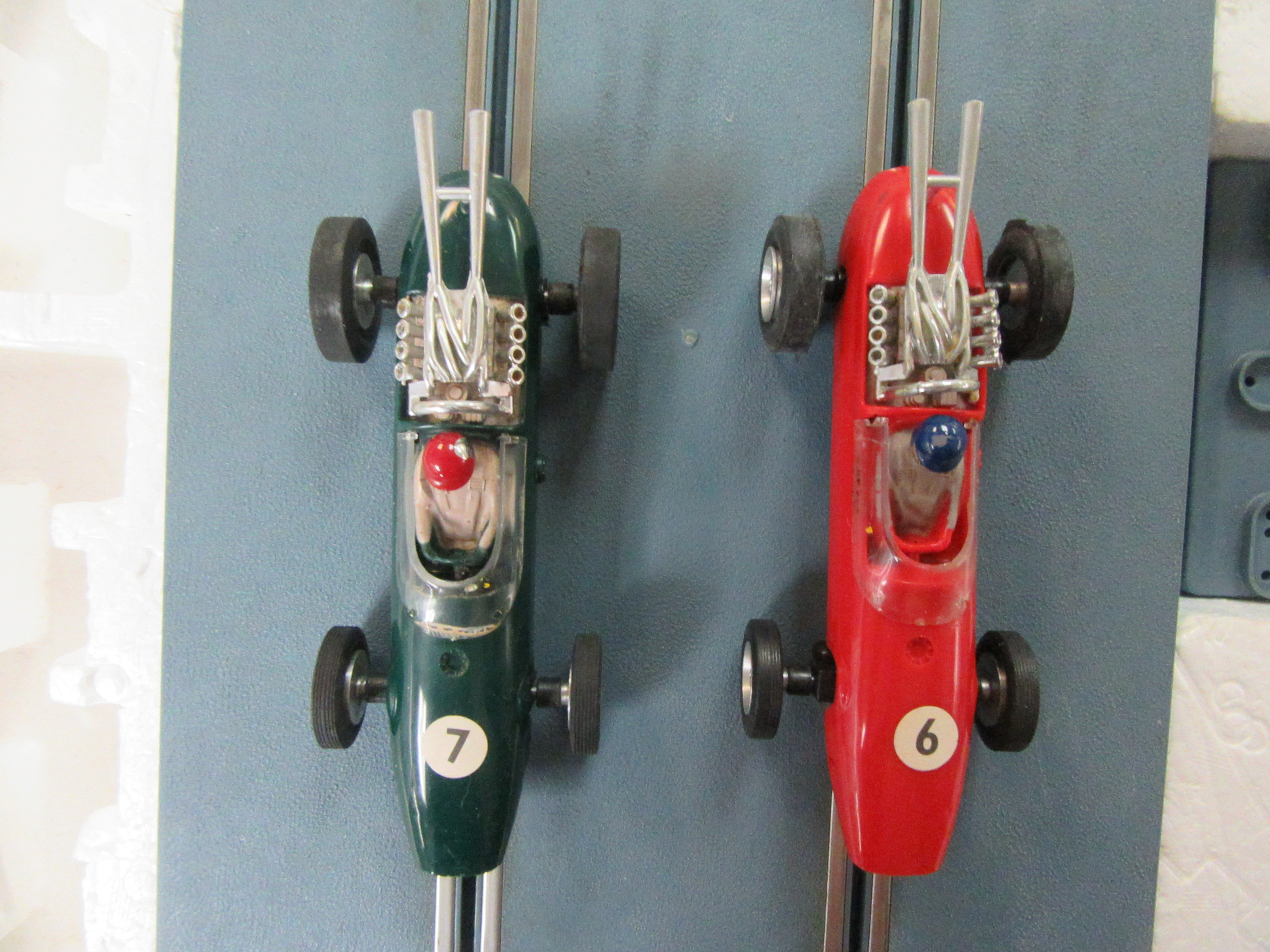 TOP VIEW OF THE 2 ELDON GREEN & RED 1964 LOTUS 34 CARS. UNIQUE TO THE 1ST KITTY SET.