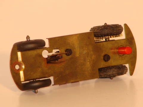 brass underside of the car showing the front pin & contacts & back pin.
