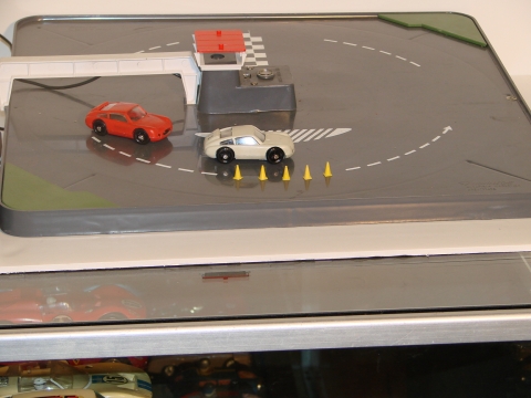 CARS RUN BY A MAGNET UNDER THE TRACK