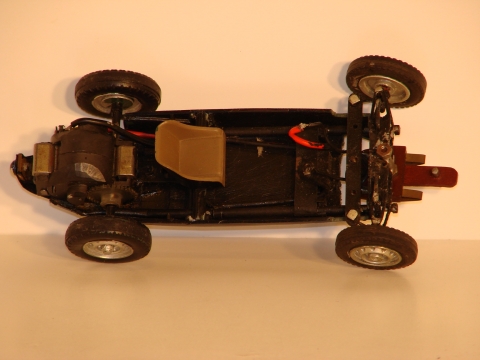 INTERIOR OF THE 1/24TH SCALE CONNAUGHT, SHOWING THE SCALECTRIC MOTOR USED IN THE EARLY TINPLATE CARS & THE STEERING.