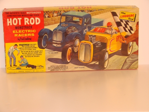 1/24TH SCALE HOT ROD SET. THE CARS RAN ON A PLASTIC TUBE. LIKE A RAIL CAR